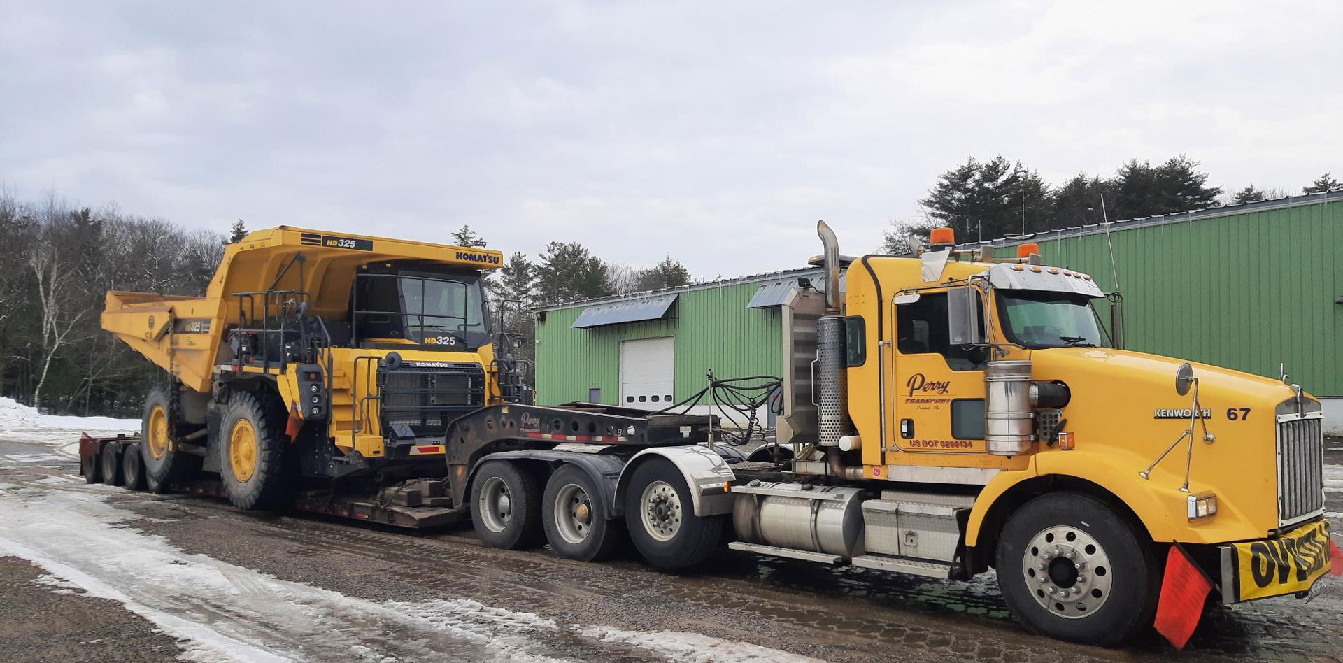 Perry Transport Inc truck hauling equipment