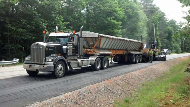 Perry Transport Inc truck hauling equipment